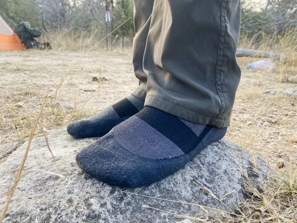 Standing on a large with wearing baresocks