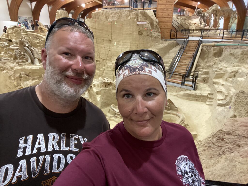 sturgis 2024 day 11 - standing in front of the mammoth dig site in hot springs