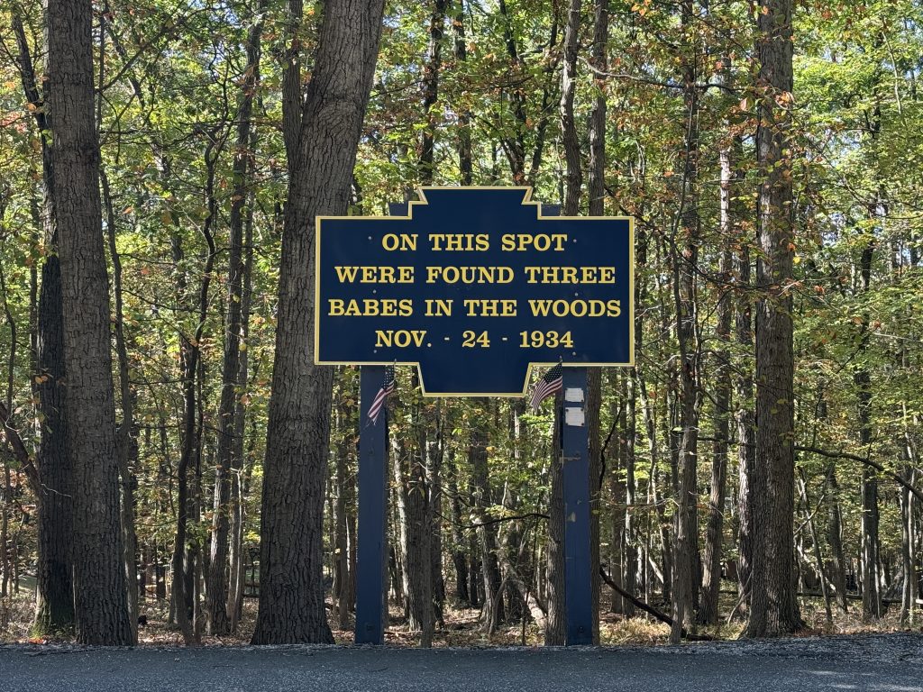 babes in the wood sign on the side of the road