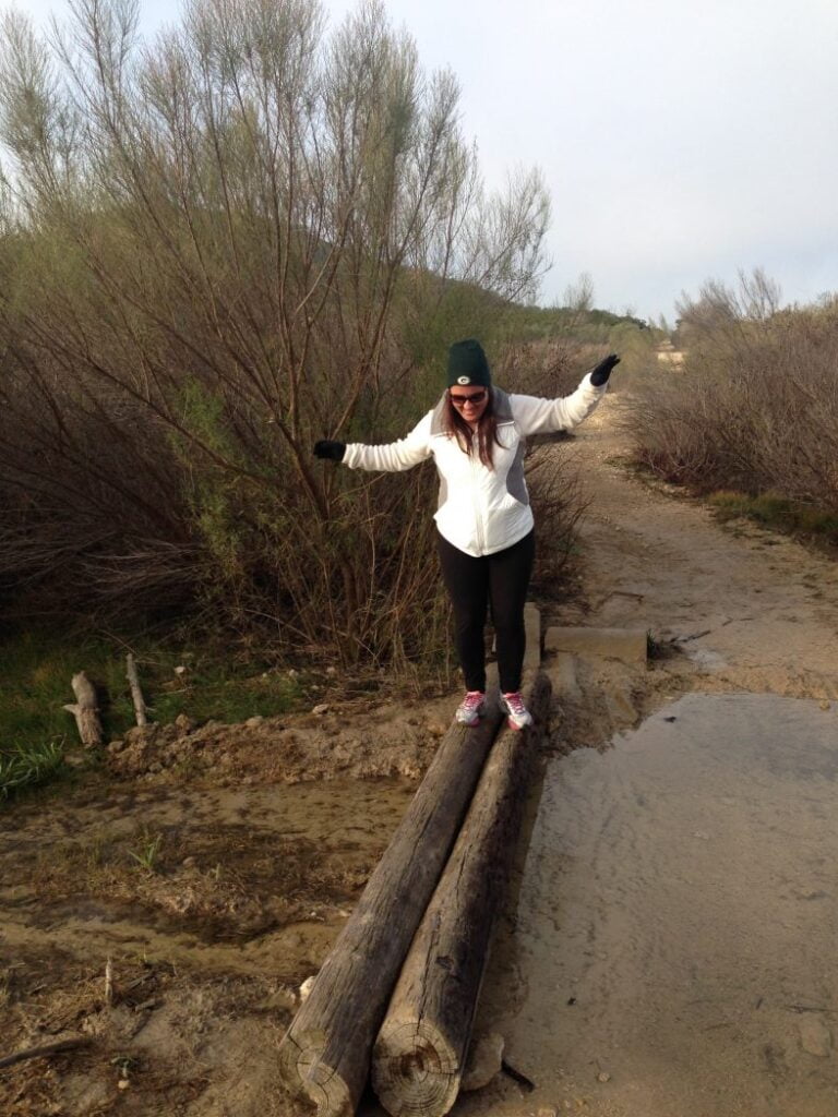 Teresa crossing logs at Dana Peak Park