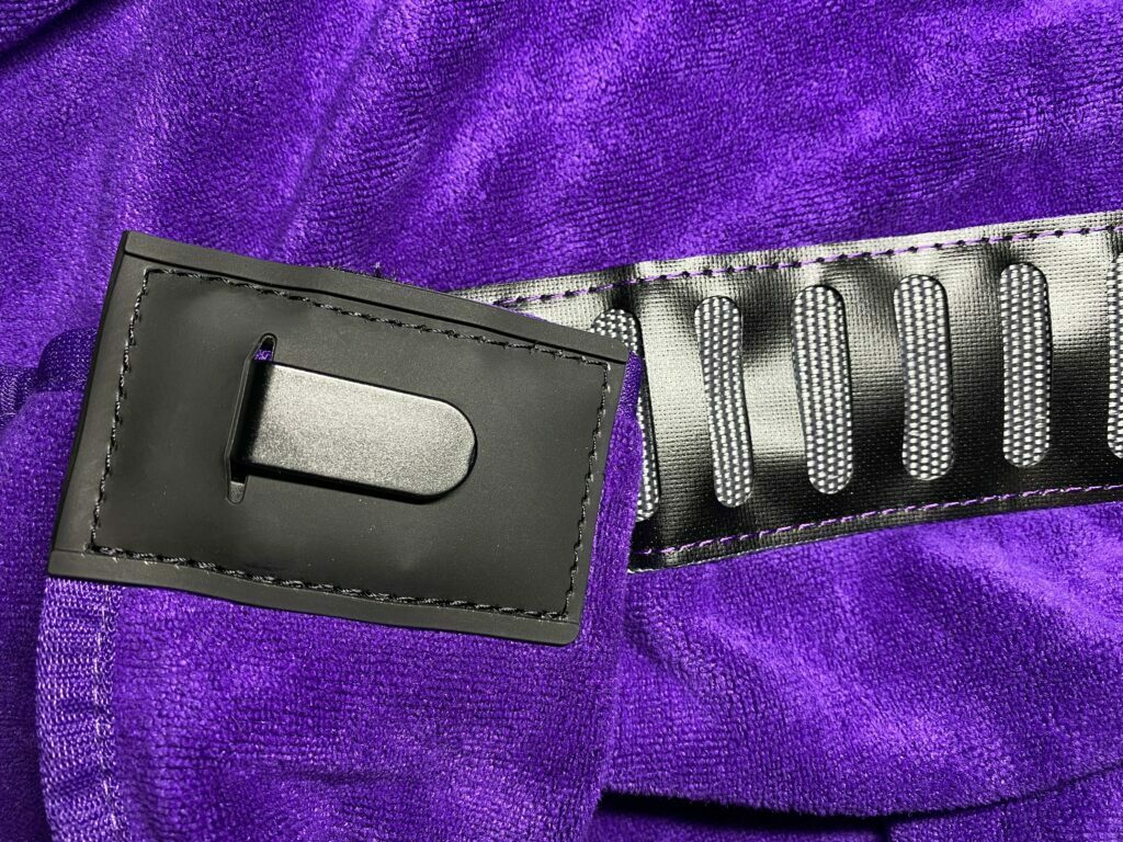 Close up of the Orange Transition Wrap belt-type system with a secure clip