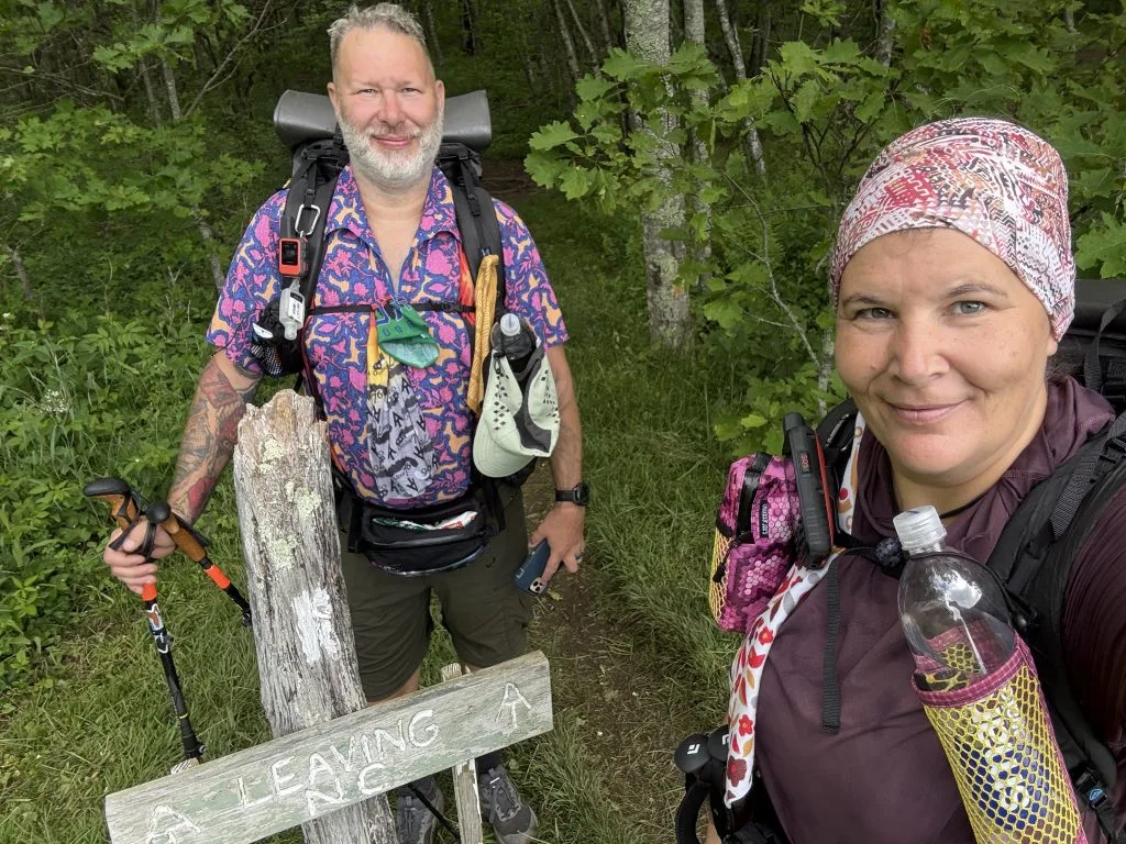 standing in front of the leaving NC sign at Doll Flats