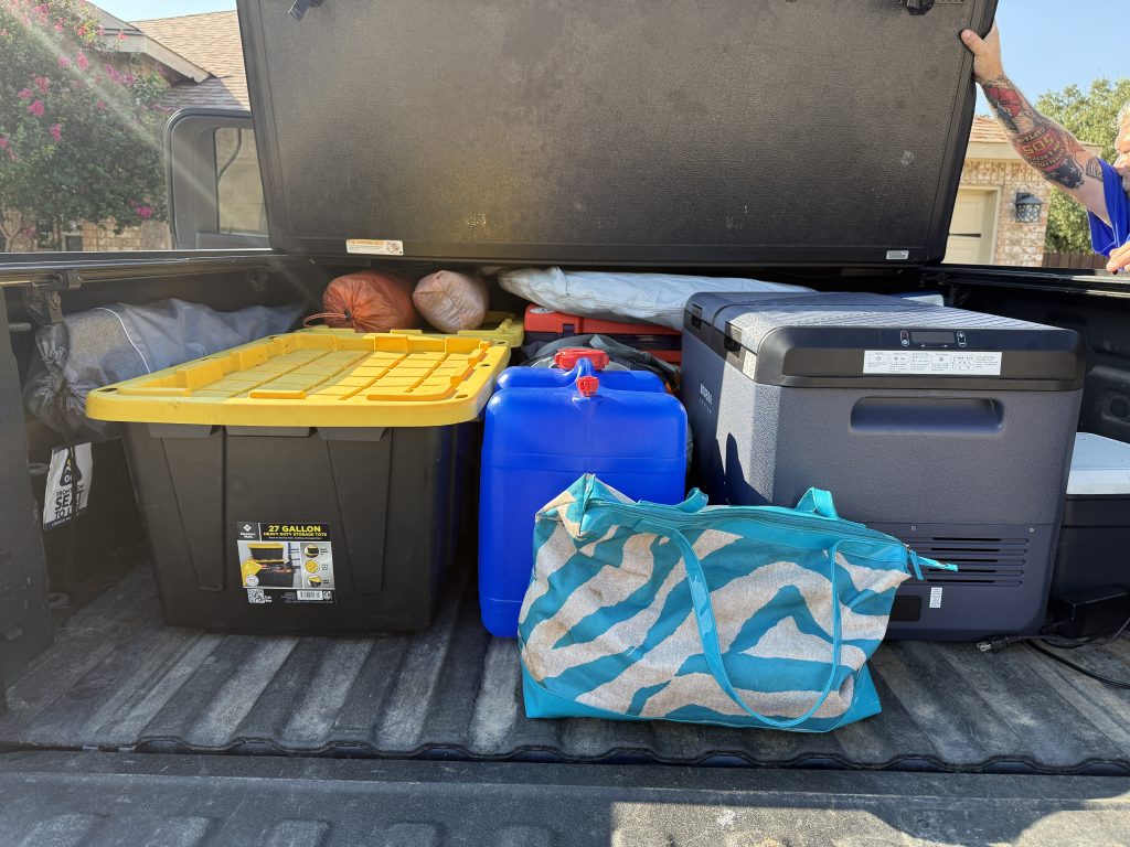 Bodega 79QT cooler in bed of the truck with other camping gear