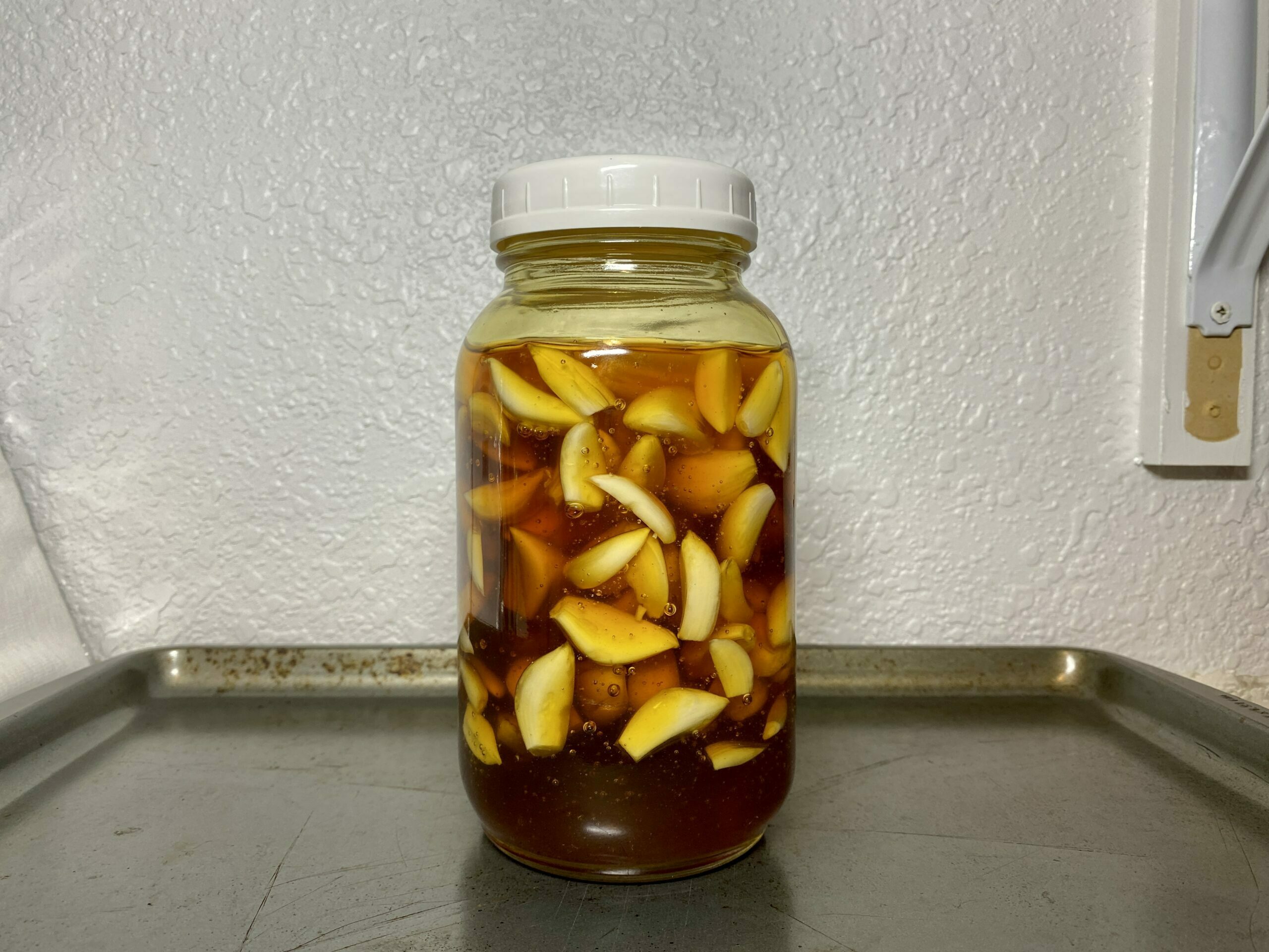 Jar of fermented garlic honey