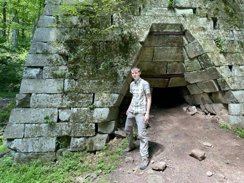 Starblazer standing in front of the Henry Clay Iron Furnace