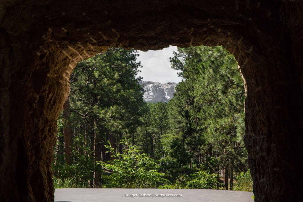 The view of Mount Rushmore Through Mountain Road Tunnel