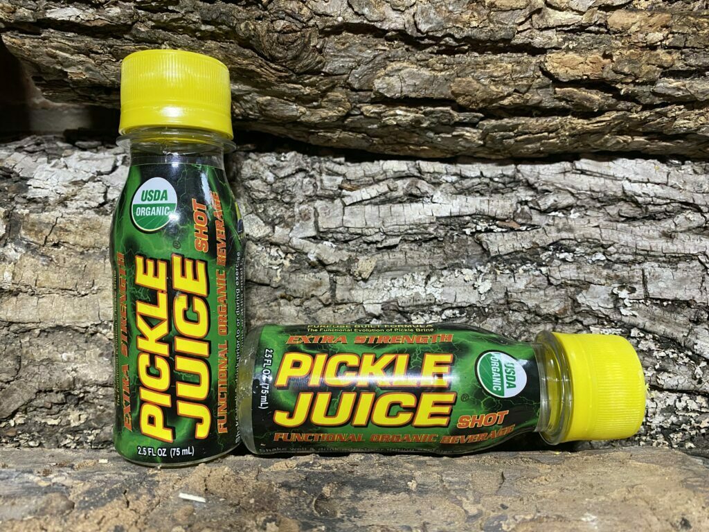 Pickle Juice shot, 2 against wood