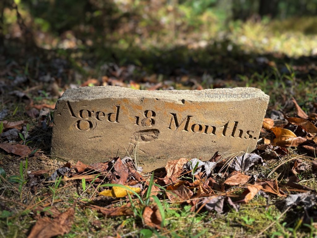 broken headstone of a toddler in Pine Grove Furnace Cemetery