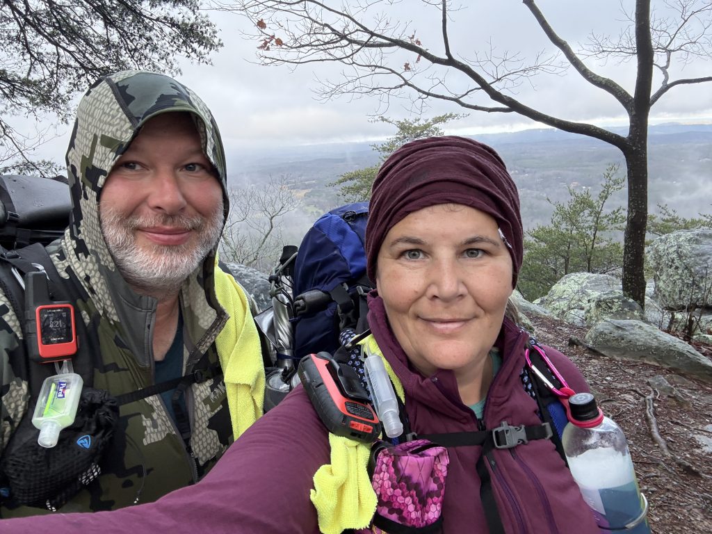 pinhoti trail day 37 standing in front of our first view of the day