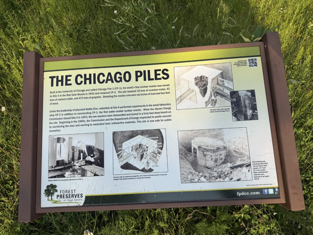 Informational sign titled "The Chicago Piles," explaining the background and construction of Chicago Pile-1 and CP-2 nuclear reactors, with period photographs and a diagram.