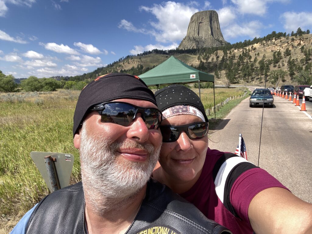 sturgis 2024 day 12 - selfie in front of devils tower from the gate