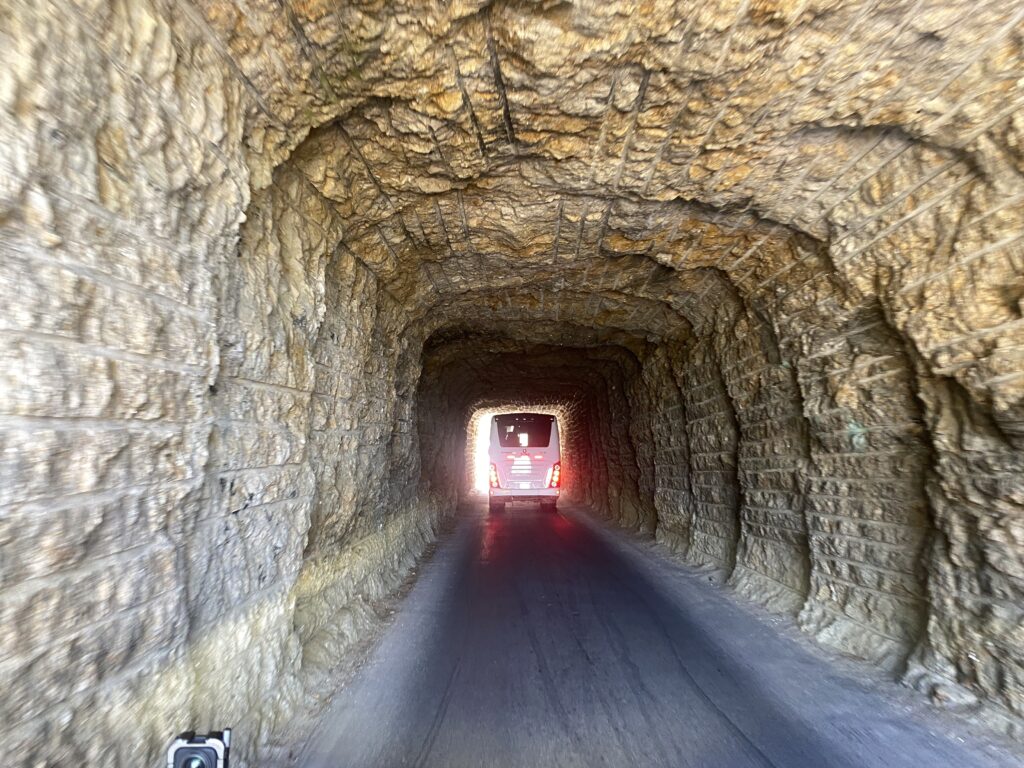 Sturgis 2024 day 10 bus going through a tunnel.