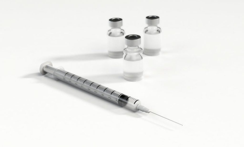 Image of a needle, syringe, flu shot